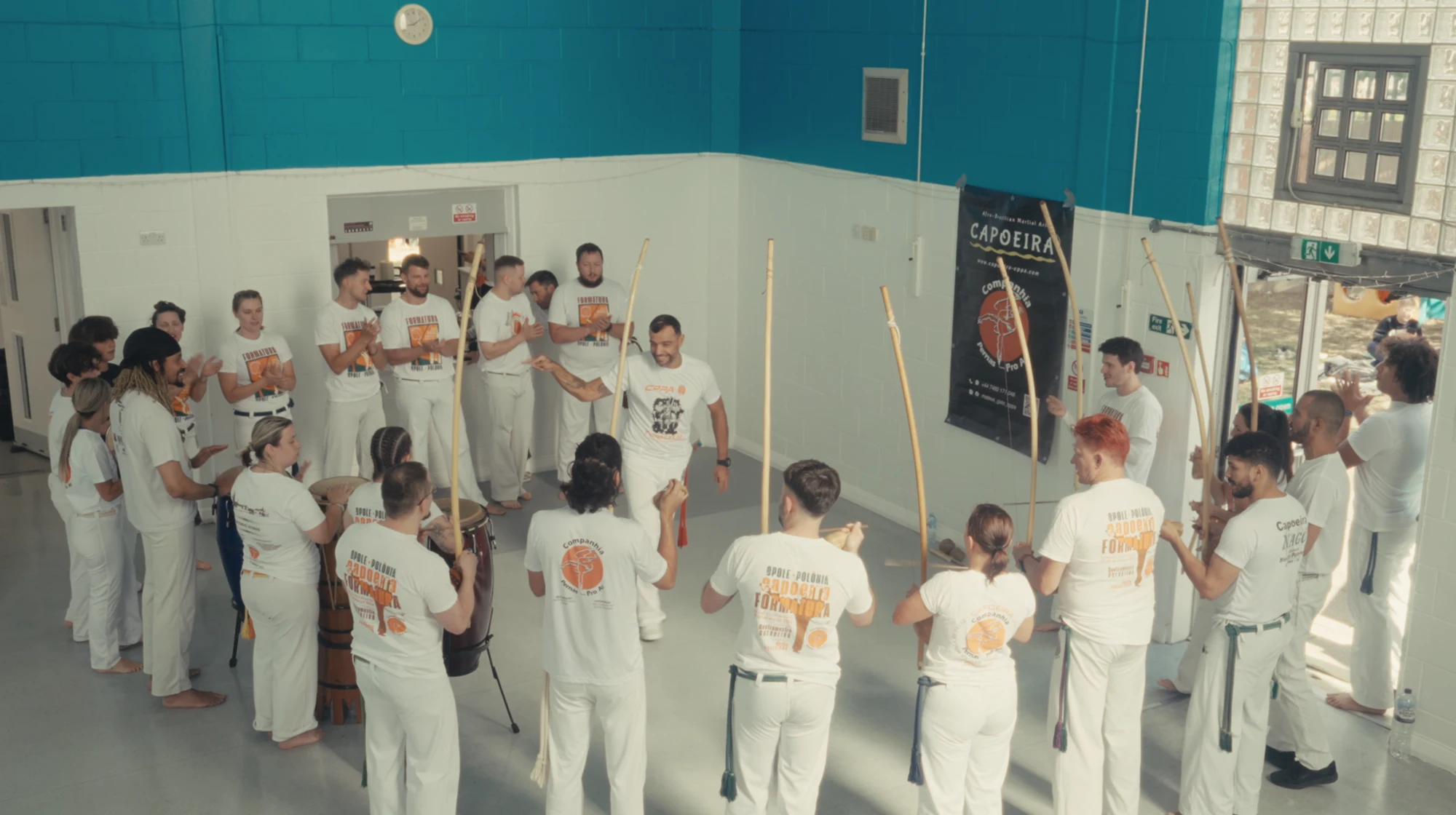 The Capoeira roda gathered with berimbaus and drums