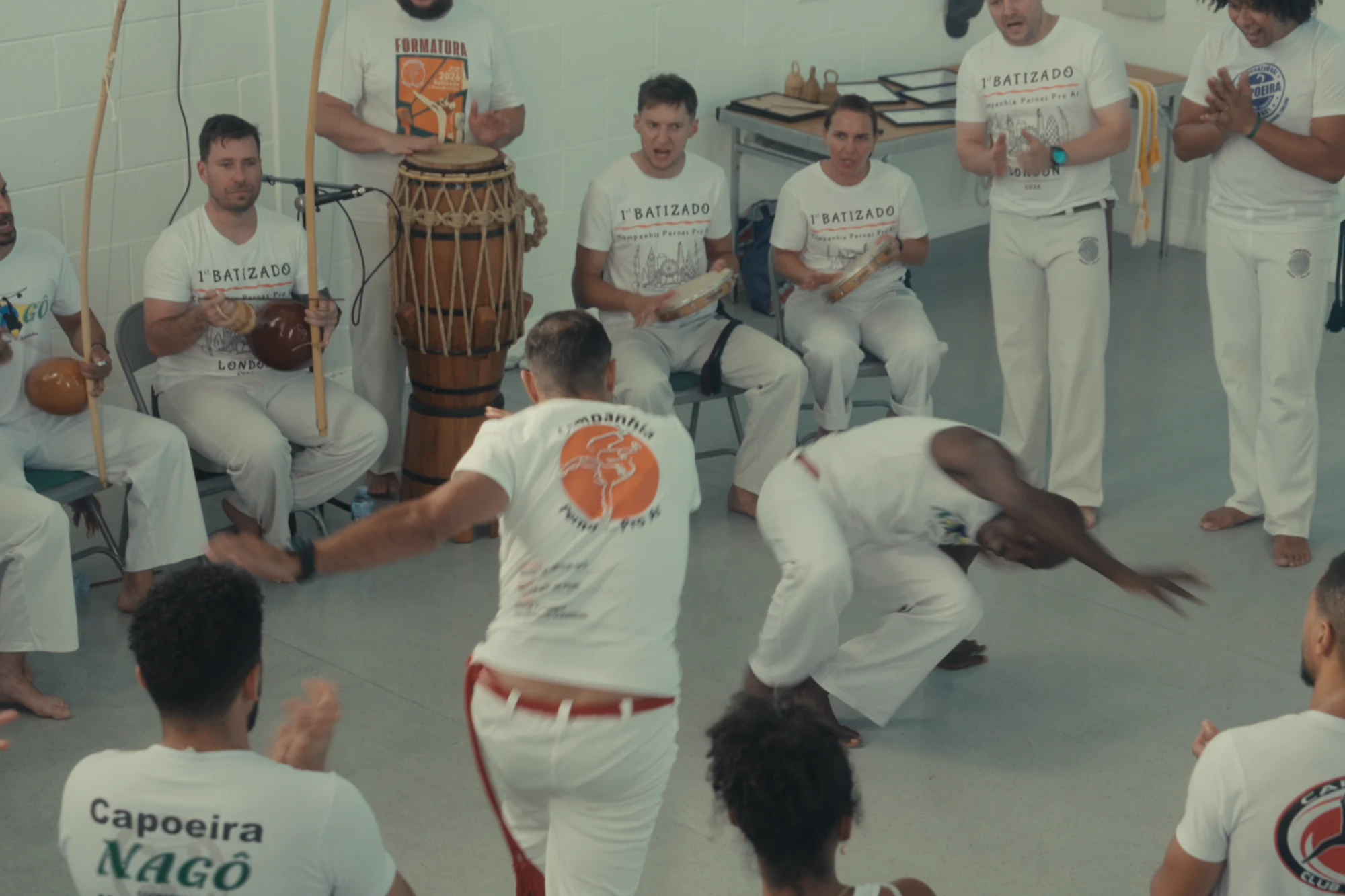 Capoeiristas playing as the roda sings and claps